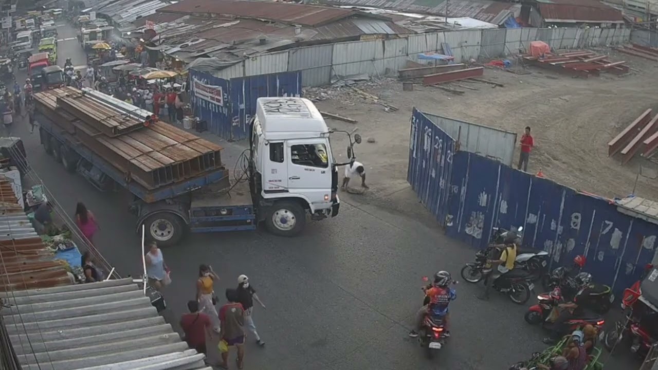 Another Steel delivery at the busy evening market time, Agdao farmers market, Philippines