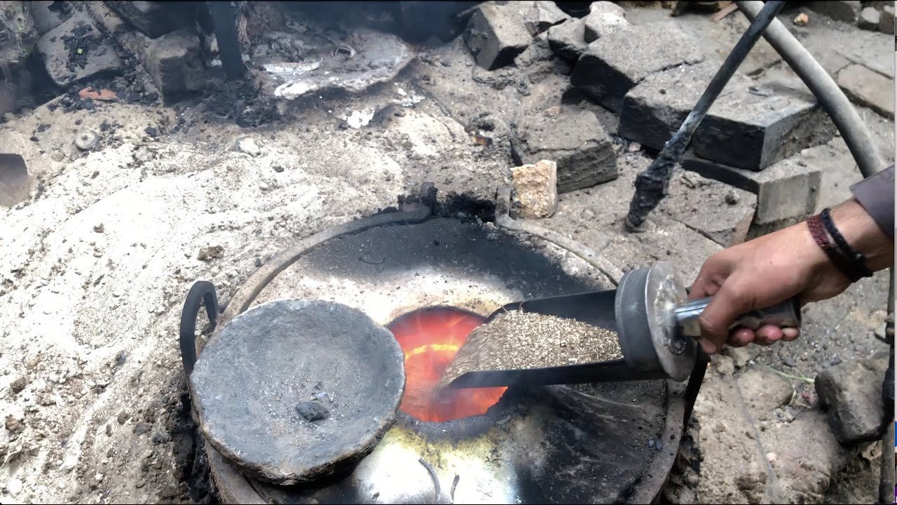 Brass Casting from Shavings at the foundry watch the Blacksmiths cast a brass machinery part HD 4k