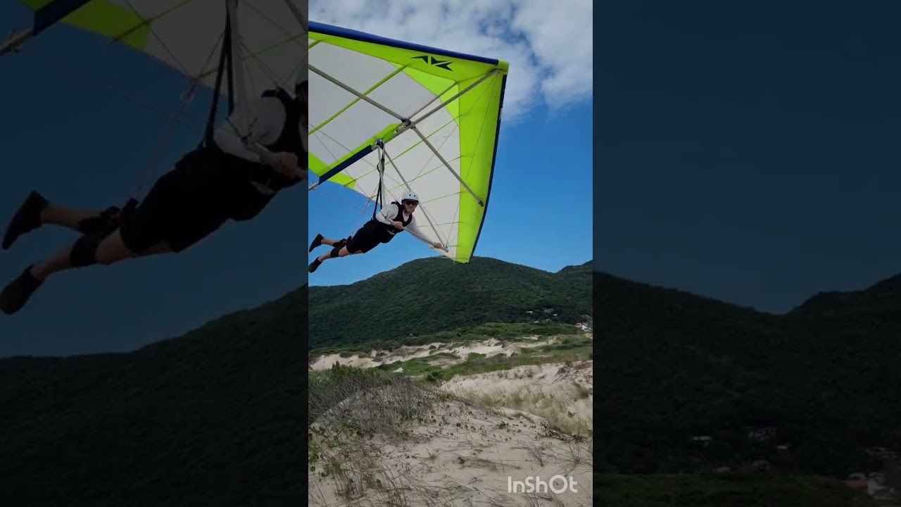 Voando de asa delta na praia 