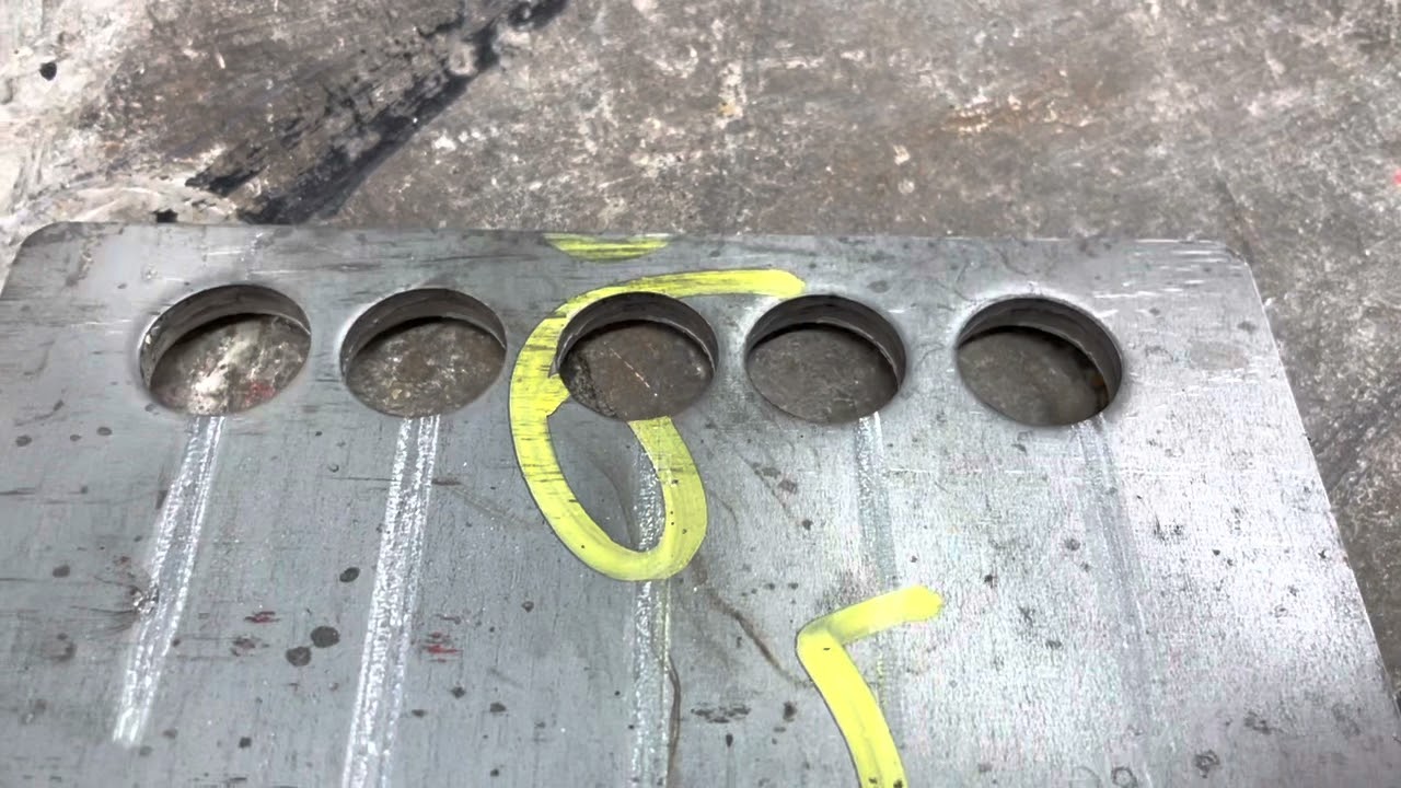 65TON ironworker demonstrating punching through thick plate