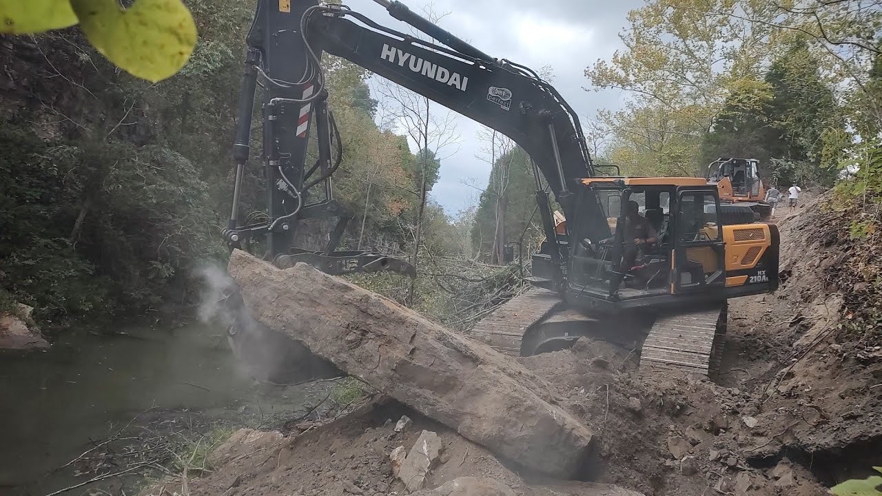 Building A Road Down The Mountain To Dam Up An Abandon Quarry