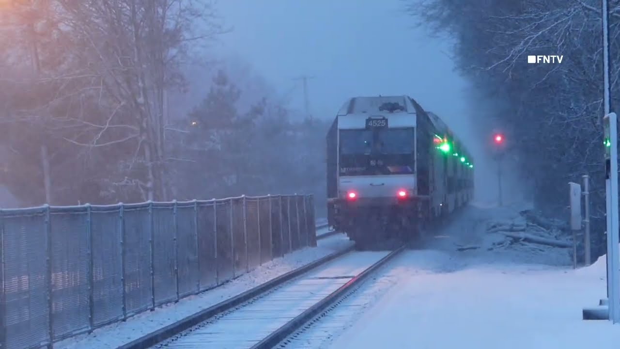 People boarding a NJ transit train and shots of when the snow start in Downtown Glen Rock NJ. 