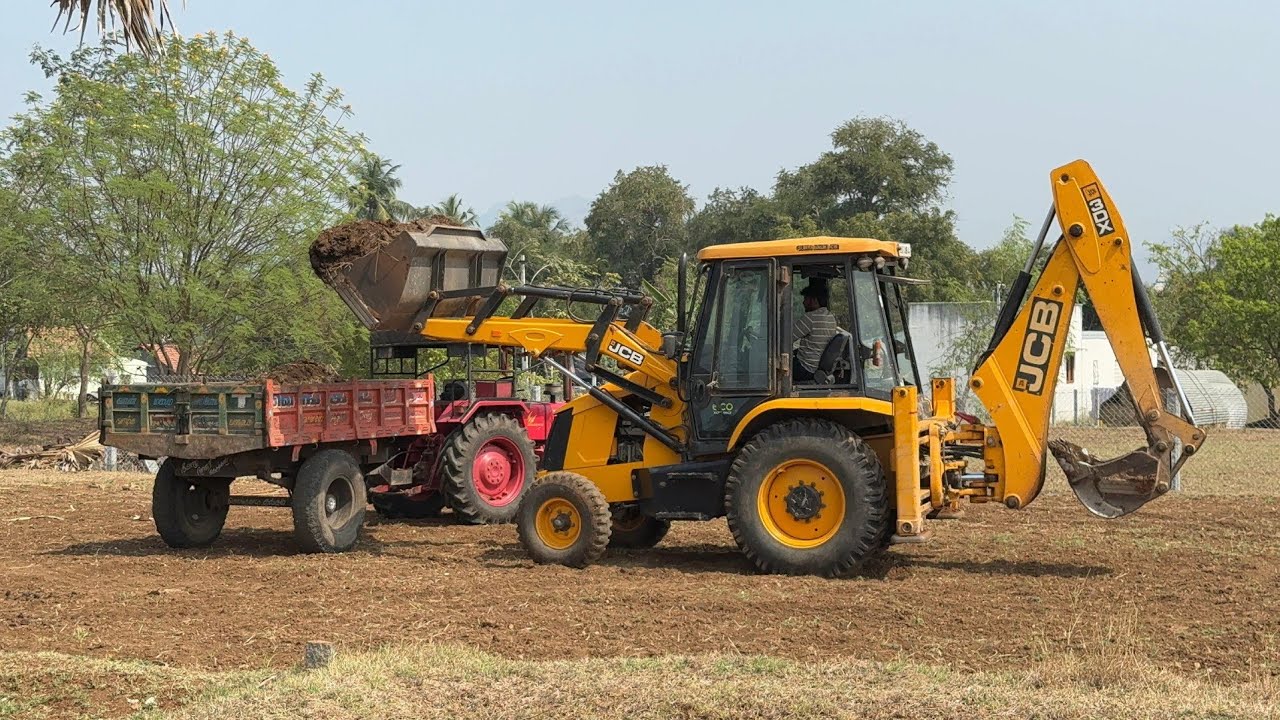 Jcb 3dx backhoe loading with cow dung for mahindra 415 di tractor tipper 