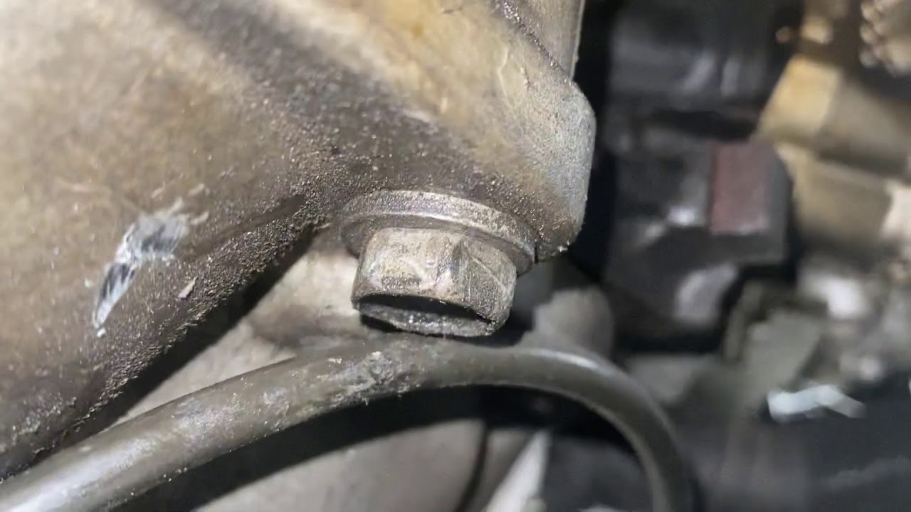 Jeep Liberty starter removal (Spanish and English)