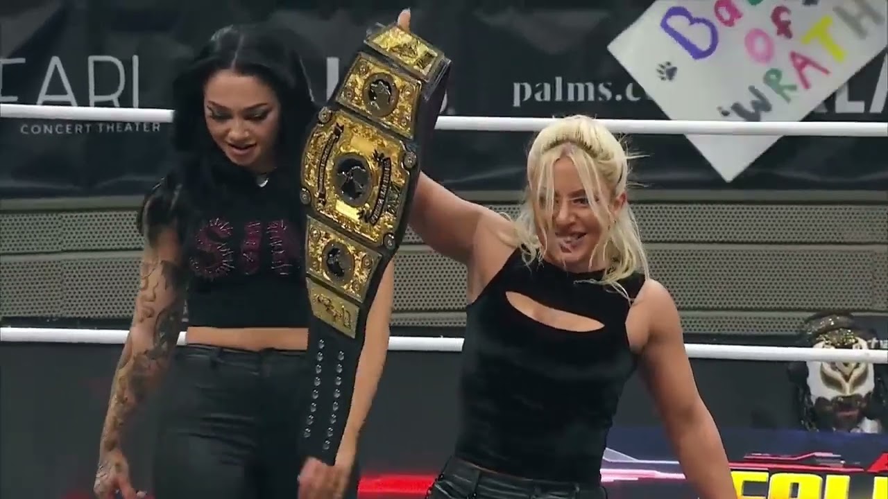 Thekla victory pose on Kris Statlander 