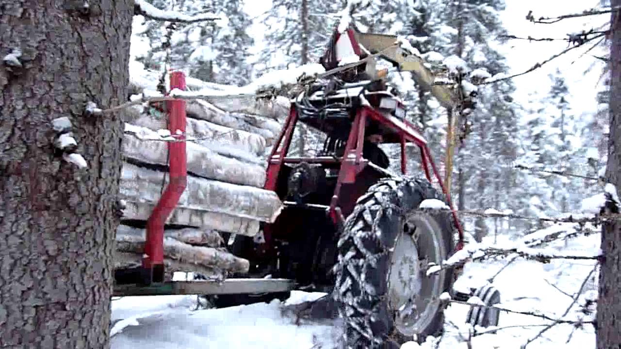 MF-65 pulling a load of firewood.