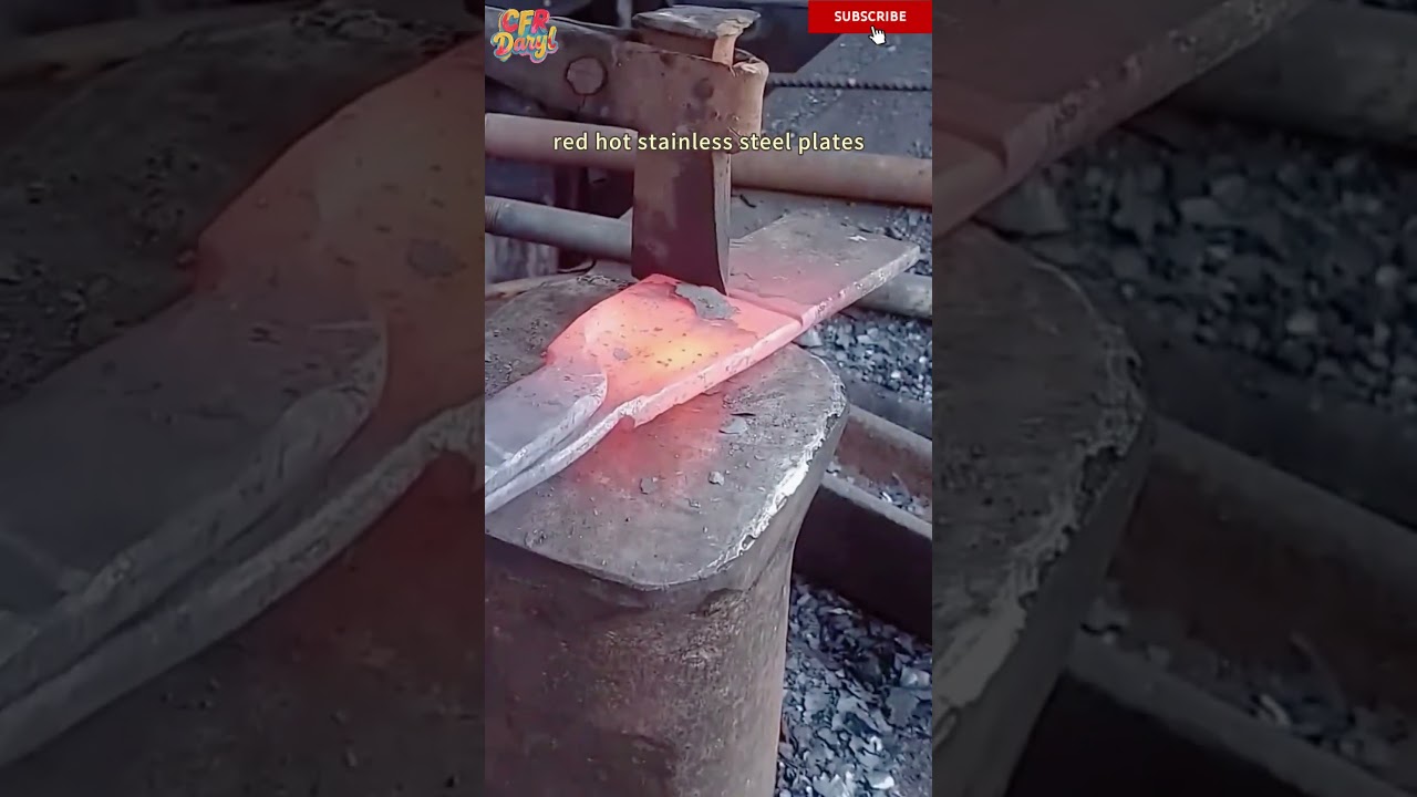 The blacksmith uses a special axe to cut high-temperature red hot stainless steel plates