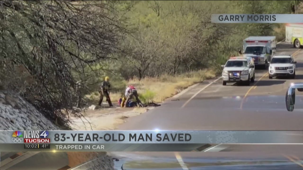 83-year-old man rescued from flooded roadway