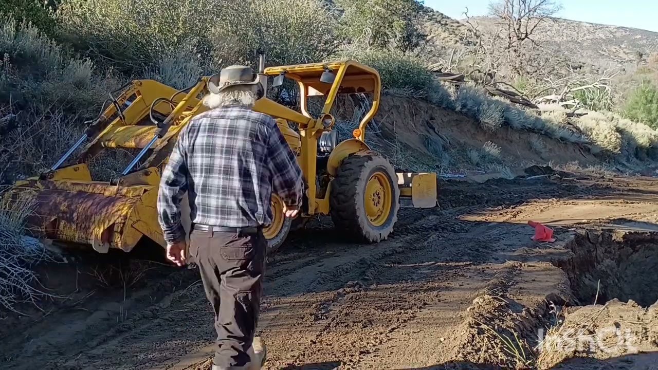 Tractor work after heavy rain making road wider and safer when you are off grid 