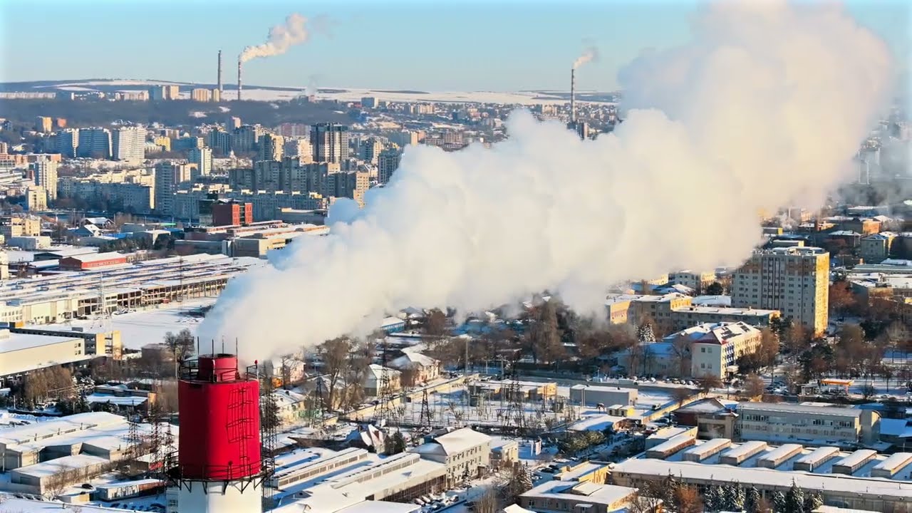 8K Ultra HDR - Aerial drone view of Winter Chisinau covered in white snow, Moldova