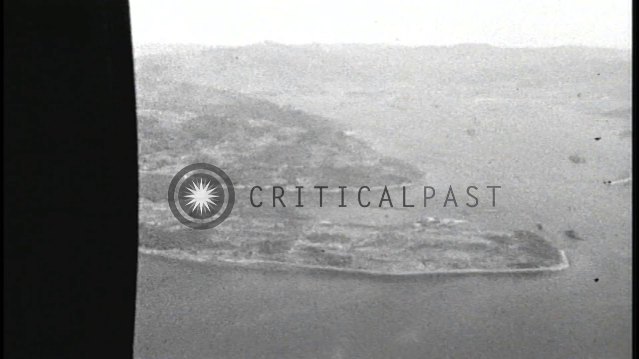 Aerial view of captured Japanese submarines being taken for sinking during Operat...HD Stock Footage