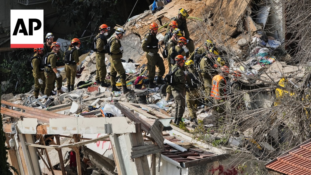 Emergency workers seen at three cities in Israel after Iran missile attacks