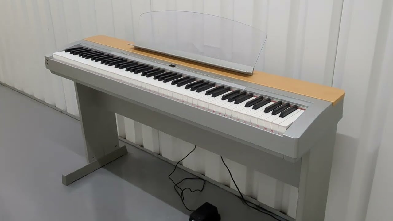 Yamaha P-140 digital portable piano and matching stand stock number 23073
