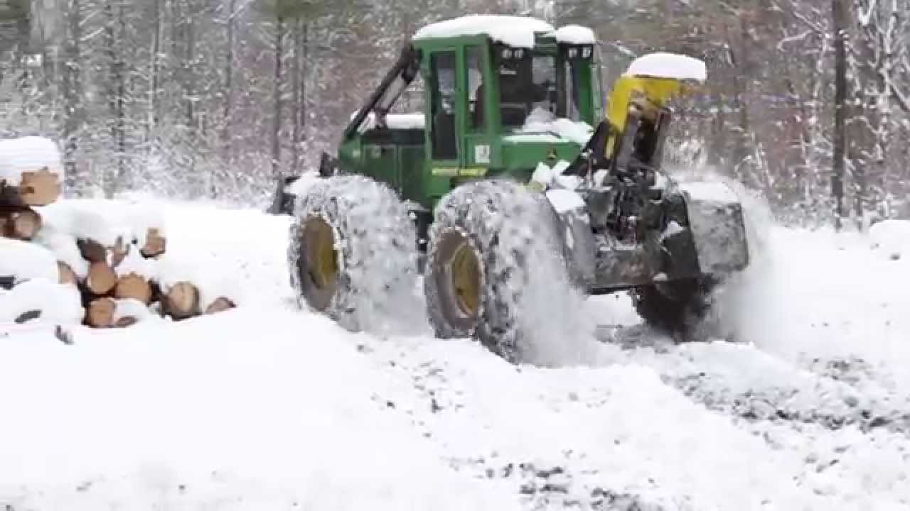 John Deere 540GIII Cable Skidder Packing Down Snow