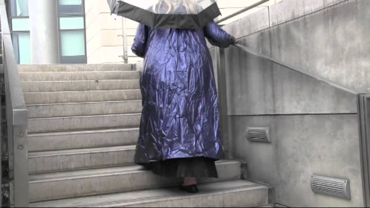 Wearing my blue PVC Mac and carrying my clear umbrella by the river