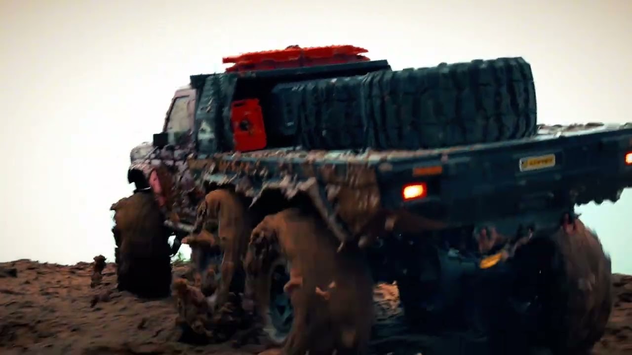 Six-wheeled RC battle on muddy off-road terrain Crossrc Bison 6x6 EMO XL 