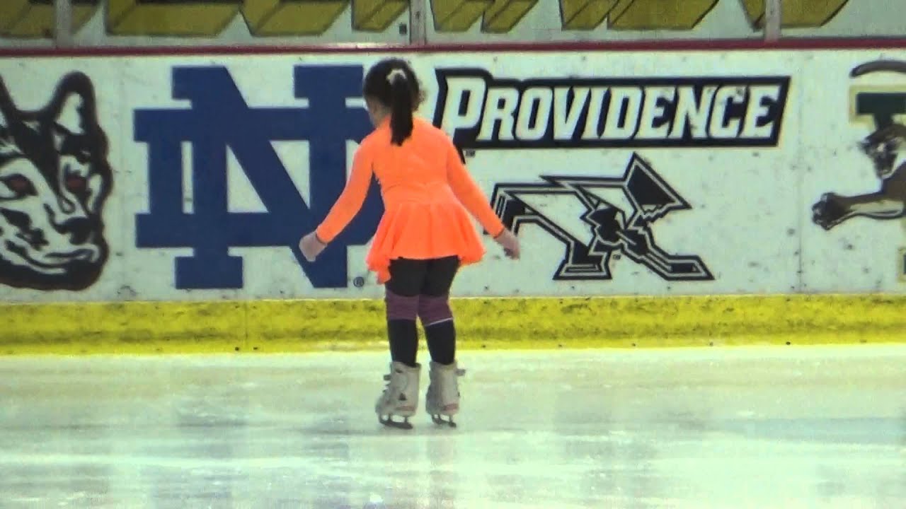 4 year old ice skater jumping on ice