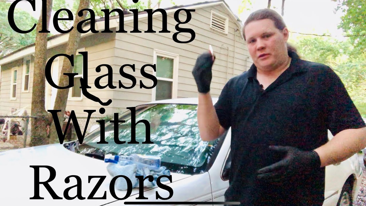 Using razor blades to clean windshield glass (4 of 4 on the 1999 Lincoln Town Car)