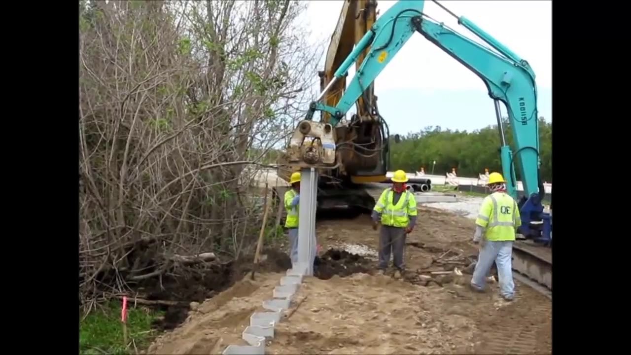 Vibratory Plate Compactor ShoreGuard&reg; Vinyl Sheet Piling Installation