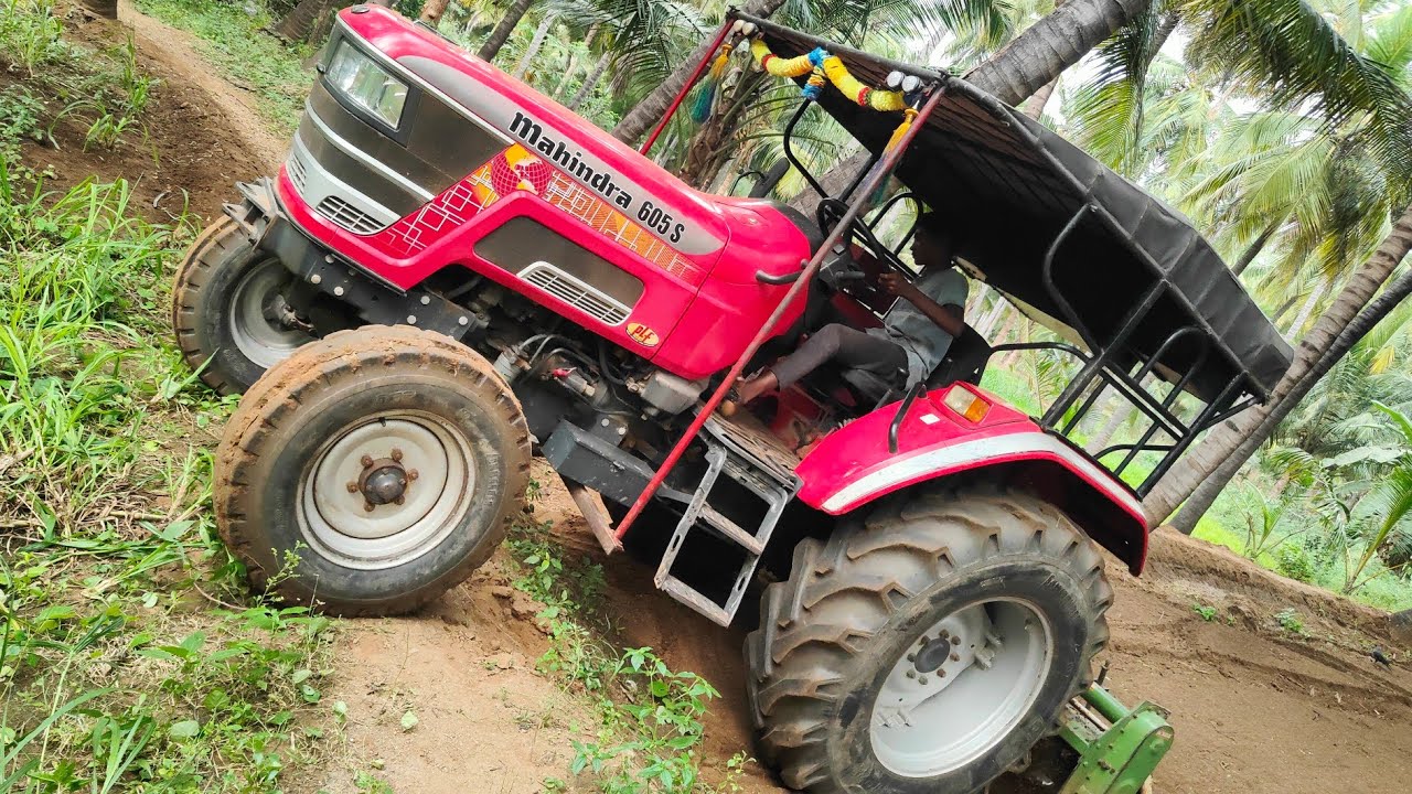 Mahindra Arjun novo 605 di 57hp tractor goes to rotavator performance in coconut trees land