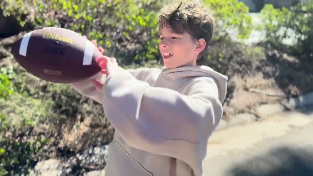 How to throw and catch a football by Gabe and Jackson 