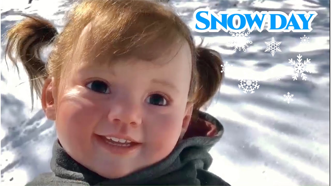 Reborn toddler playing in snow with extra video footage