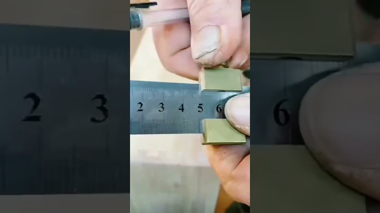 This is a small special tool that is being used to give a line to a wooden board