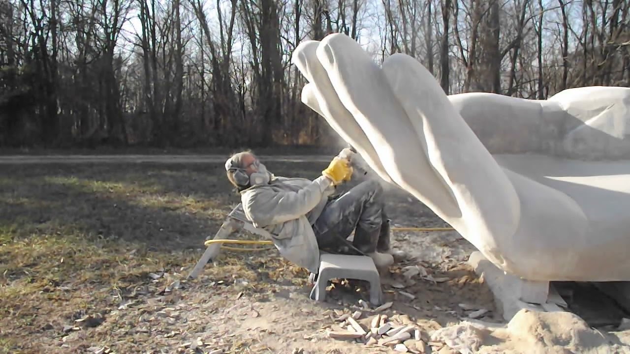 Carving stone - reclining on the job