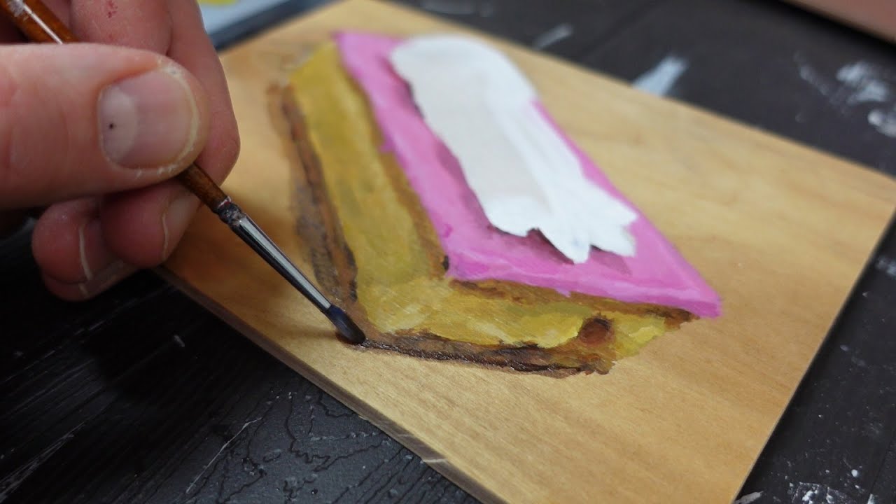 Tompouce op een plankje schilderen met acrylverf