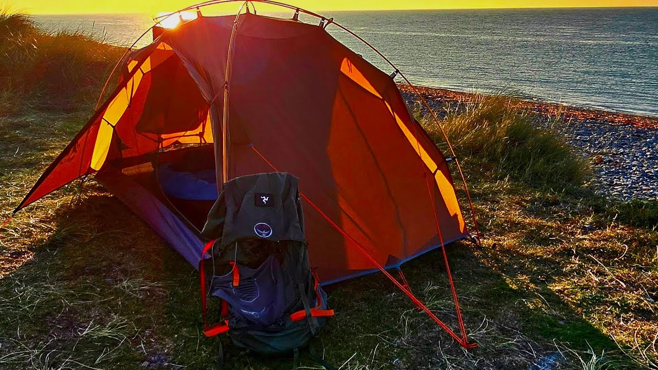 Beach camping sunset over the Irish sea.