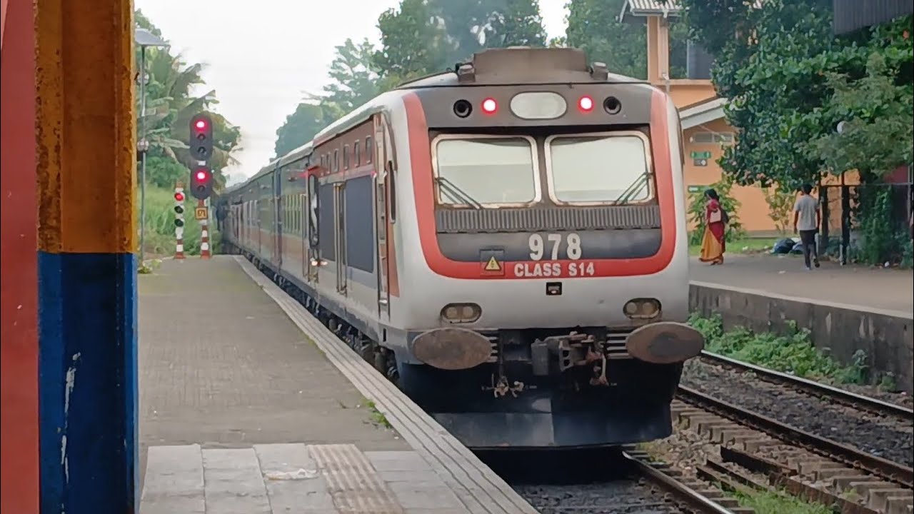 Class S14 DEMU leaves Gampaha Railway station hauling the Podi Menike Express 