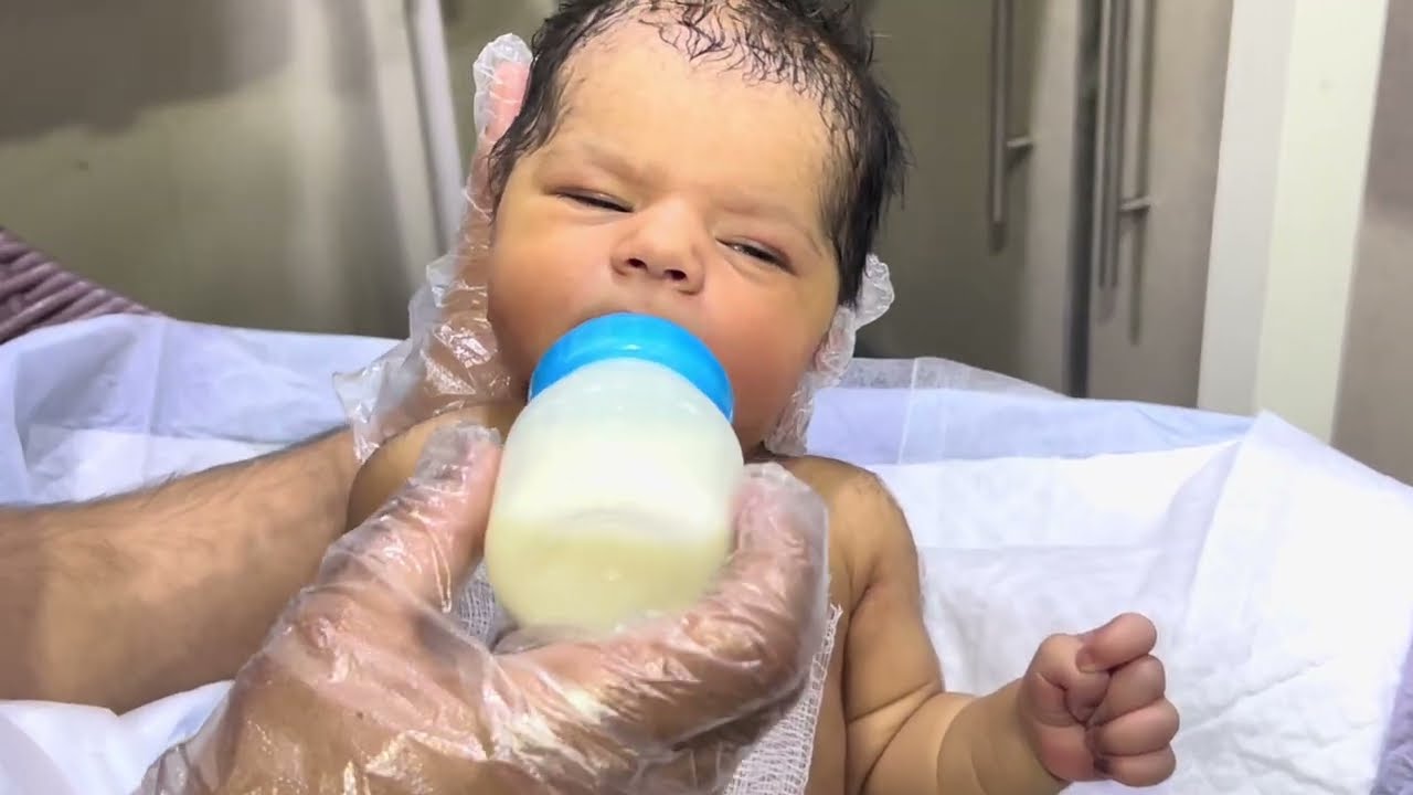 First feeding journey of a cute baby under gentle care