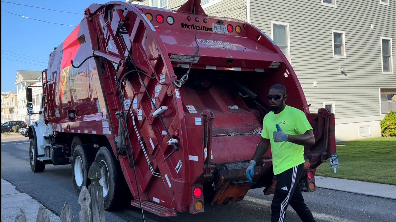 Gold medal environmental M2 McNeilus Rear Loader on Heavy trash