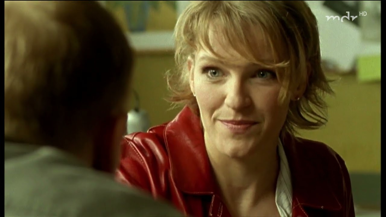 Caroline Scholze in a Red Leather Skirt Suit