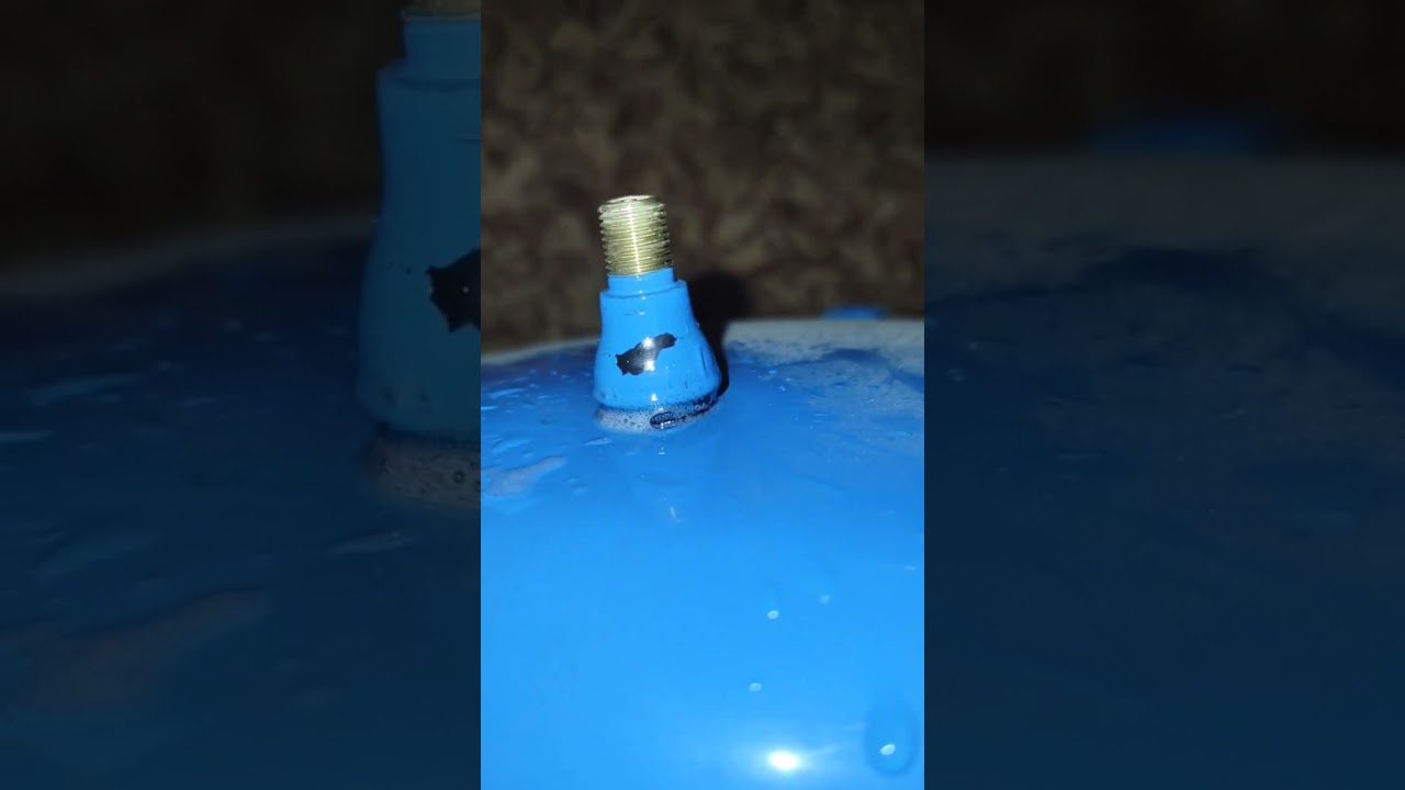 Fixing a leaking rubber Schrader Valve on a well pressure tank.