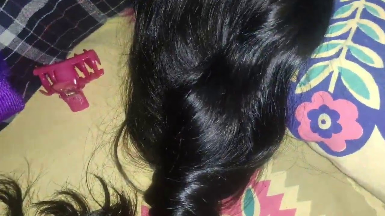 Long hair play. Bun style silky black hair in night time.