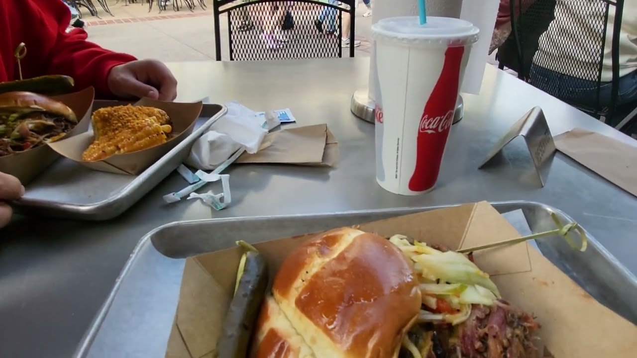 Eating at Polite Pig at Disney Springs - BBQ Sandwich and corn