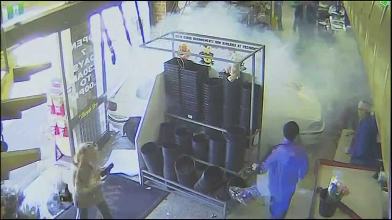 Australian drives car through Melbourne supermarket window - CCTV video