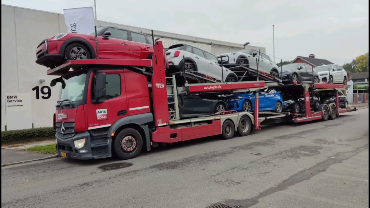 Loading Kassbohrer Metago Pro with some cars