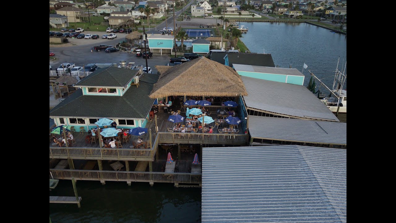Over The West End Marina And Restaurant In Galveston Texas (4K Drone)