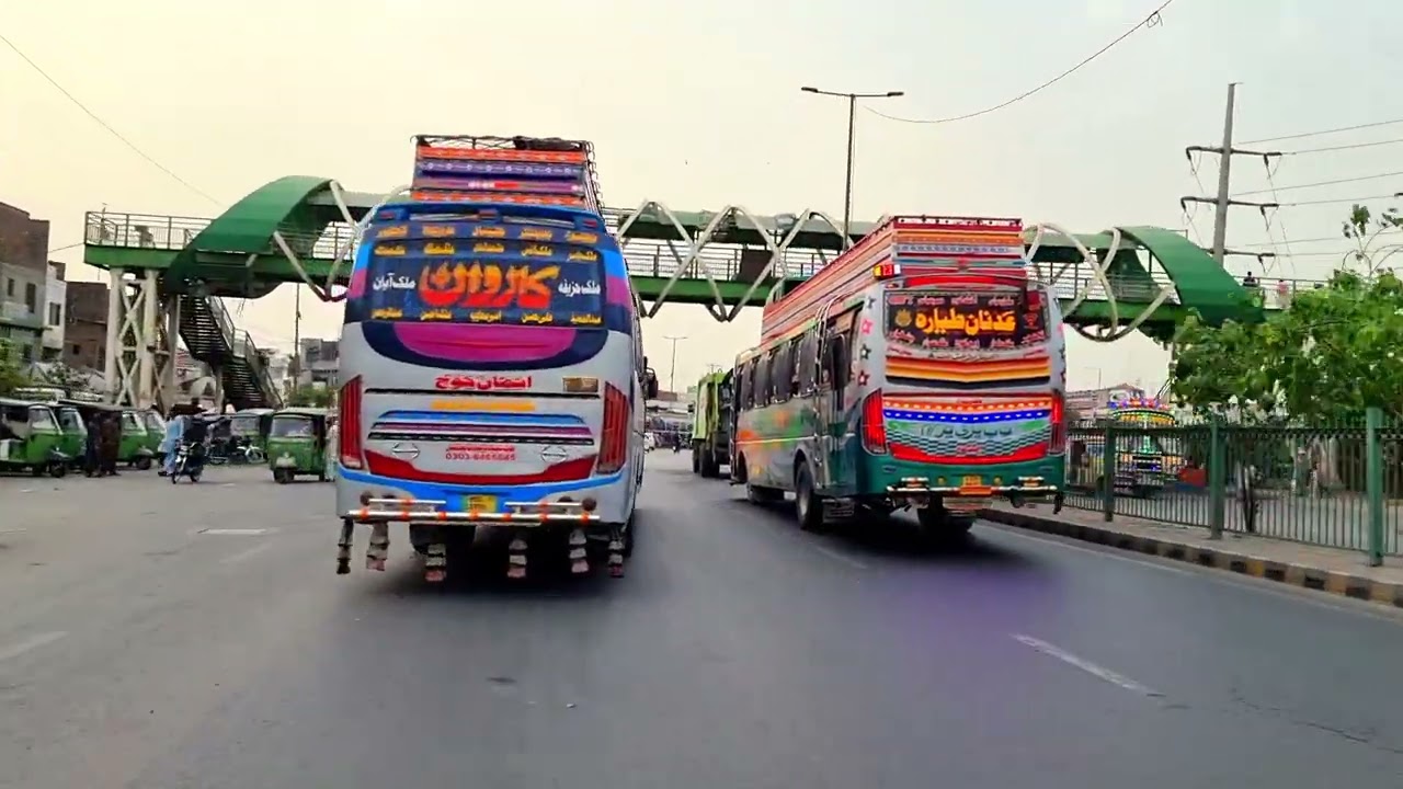 Buses arrival time morning scenes at general bus stand Lahore Lari Adda