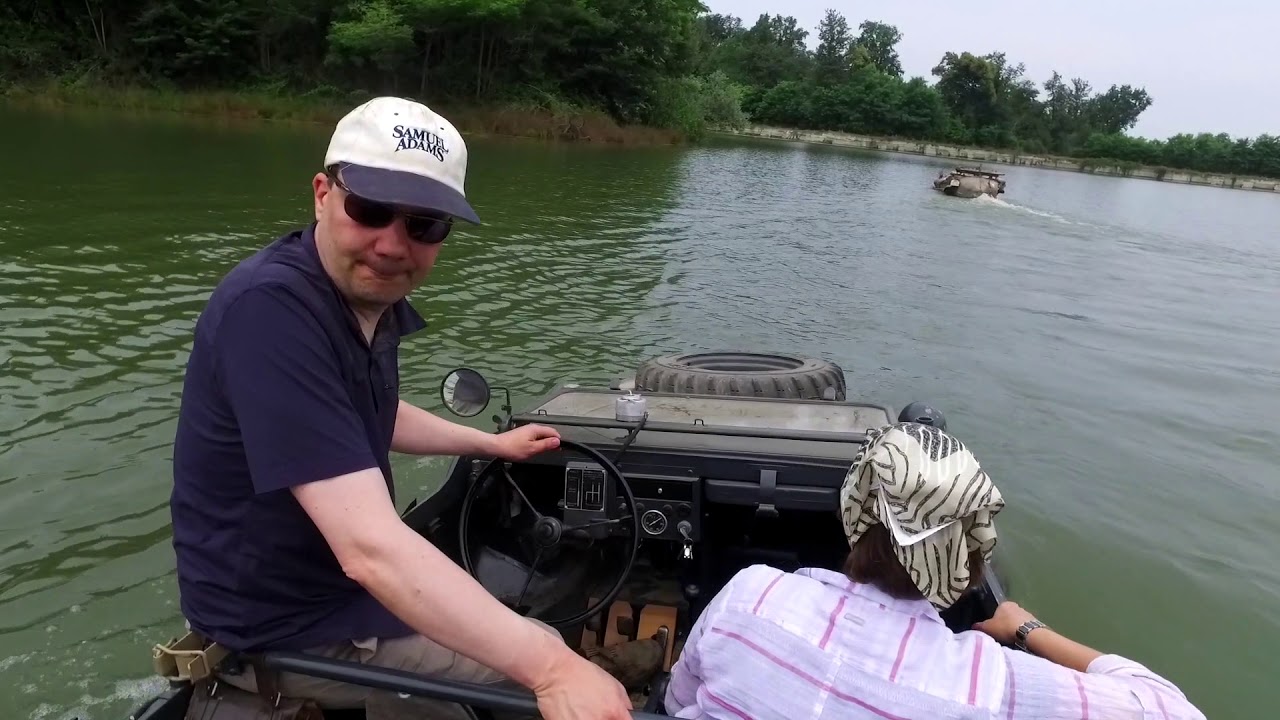 A Schwimmwagen enters a small lake in northern Italy.