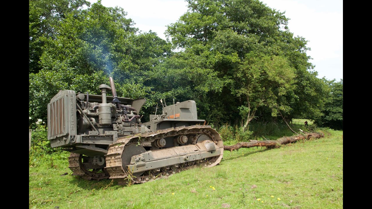 Caterpillar D8 bulldozer hauling out 100 foot tree and pony motor start
