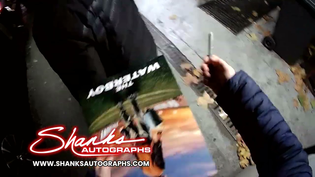 Adam Sandler signing autographs I promise despite you can't see his face :)