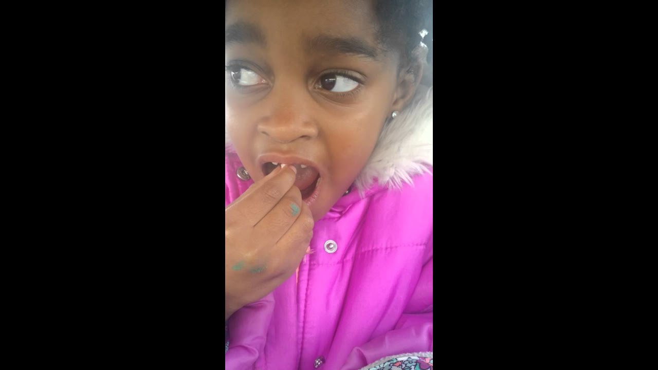 I let My 6 year old pull out her loose tooth.