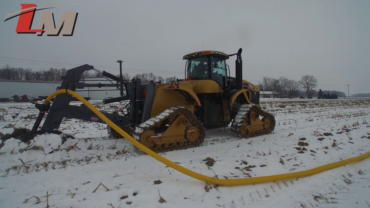 CAT on Tracks with Liebrecht Mounted Tile Plow