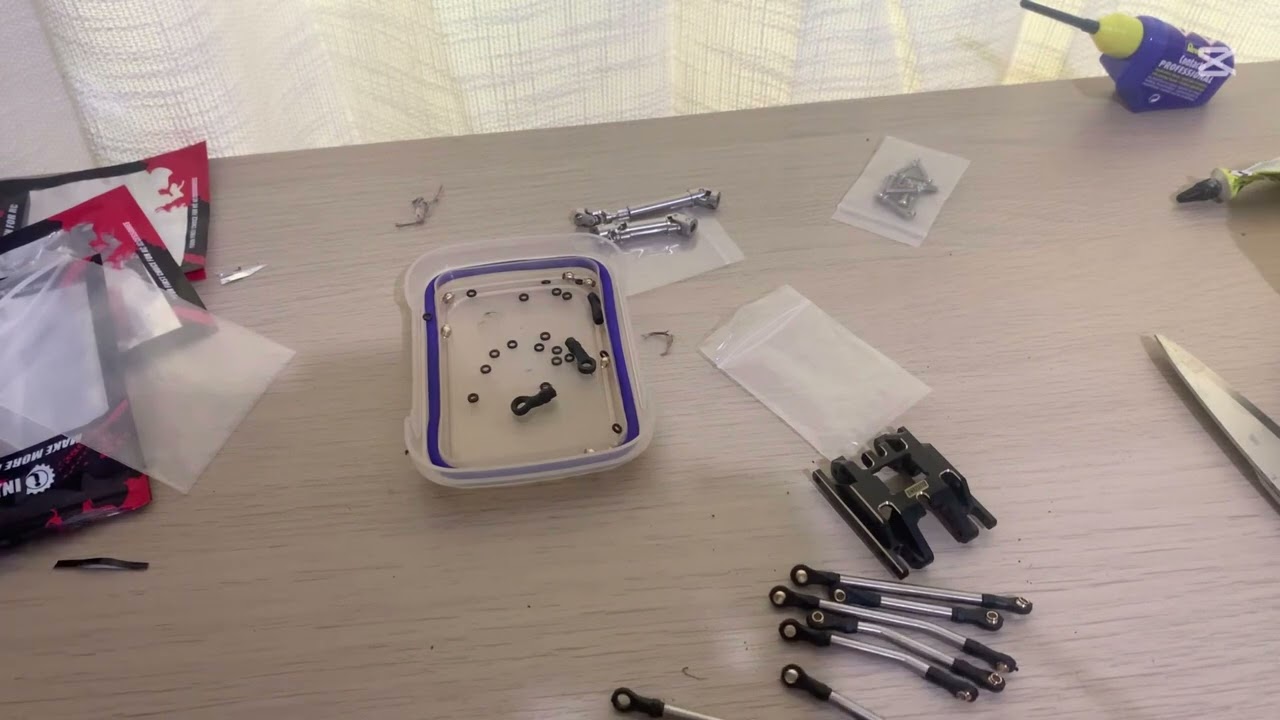 Part 1 Installing Injora high clearance links,skid plate,lay down servo mount and drive shafts