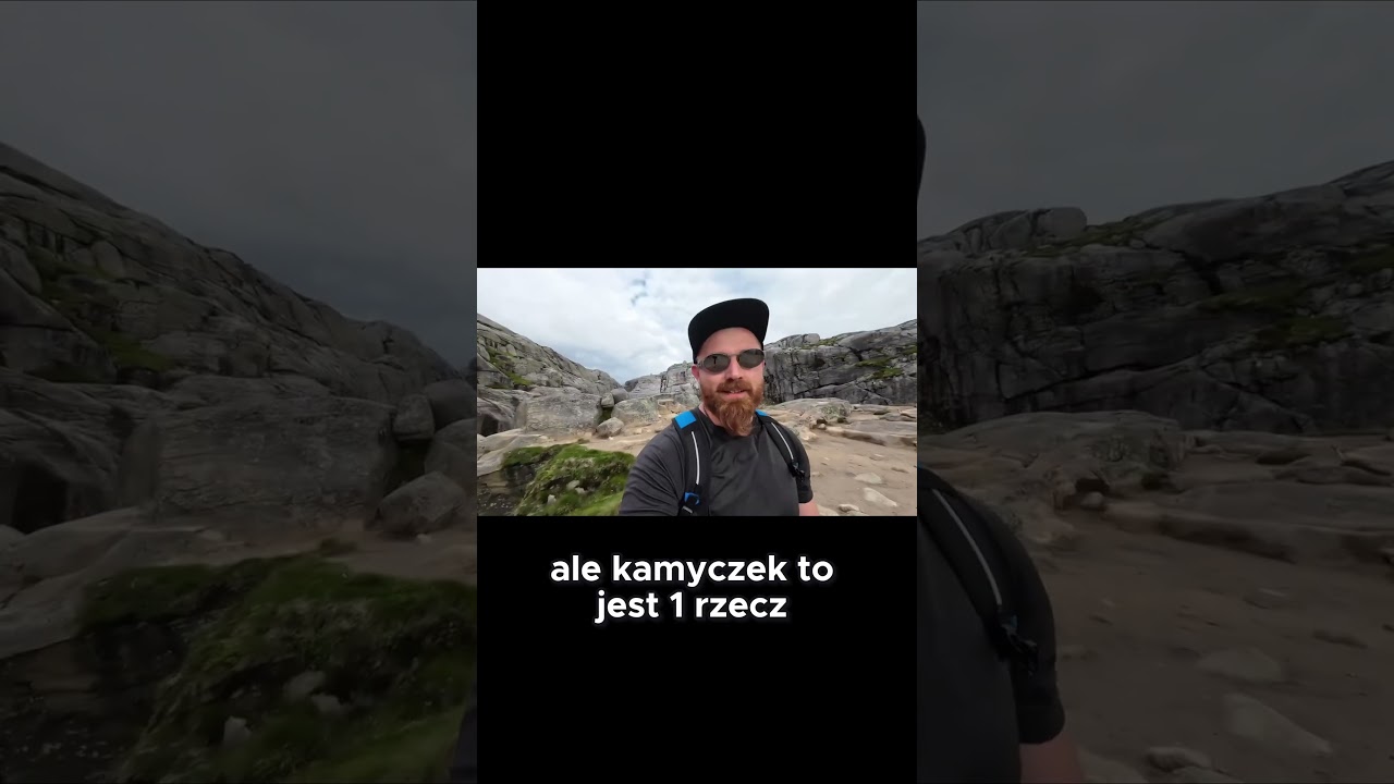 Spektakularny widok z Kjerag &ndash; kamień między skałami