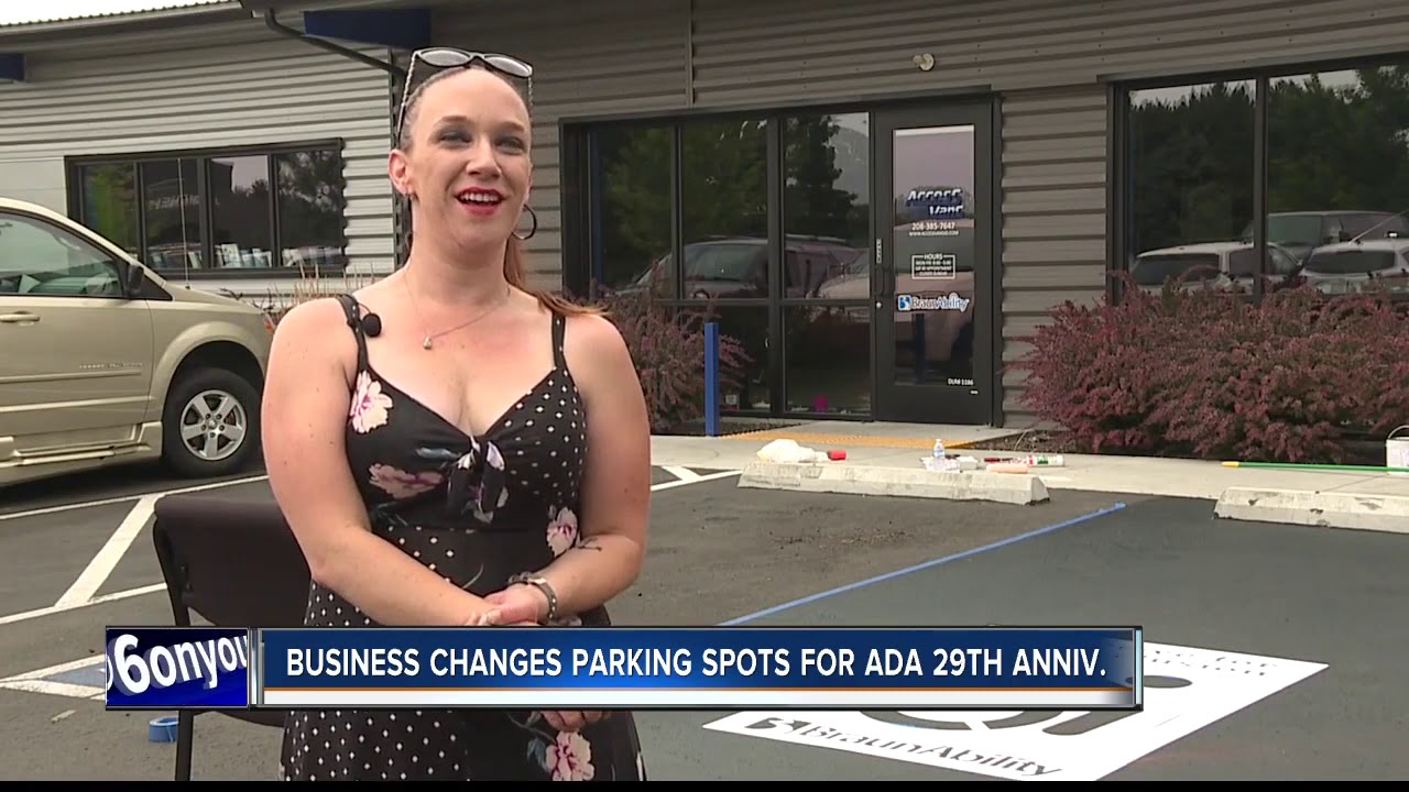Local business changing handicapped parking for ADA anniversary