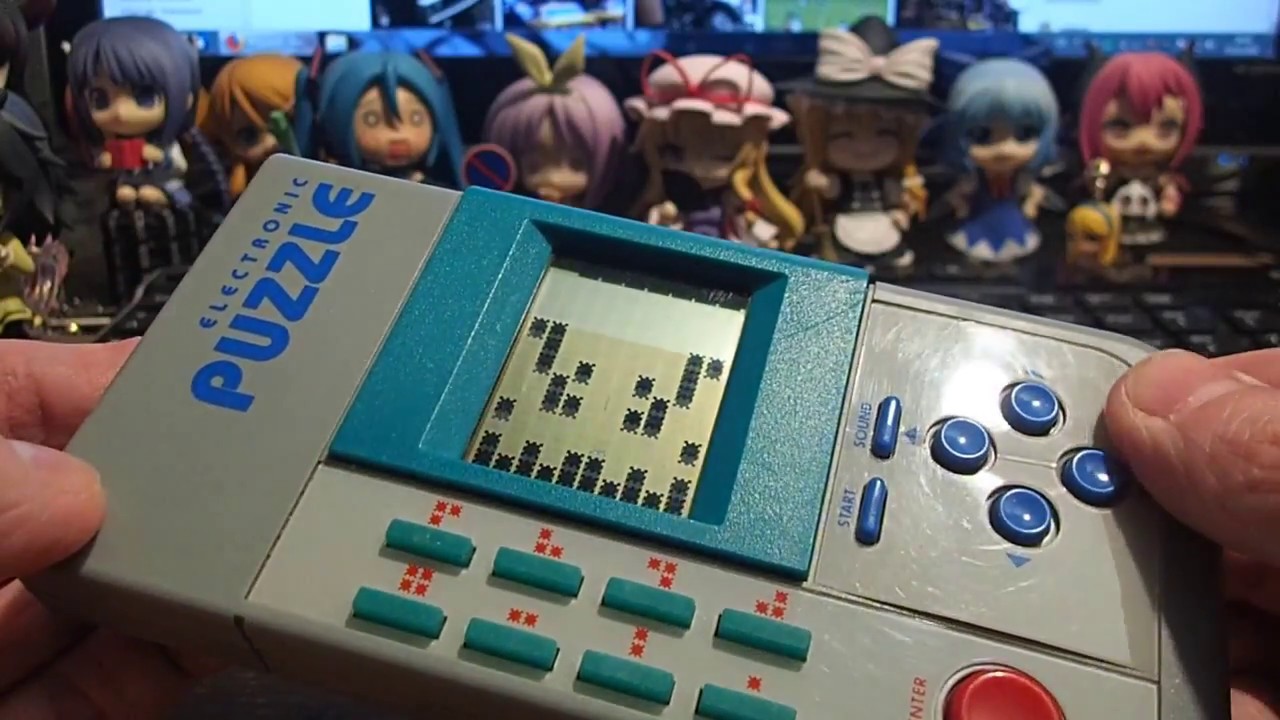 electronic puzzle handheld game console from 1986 with LCD display